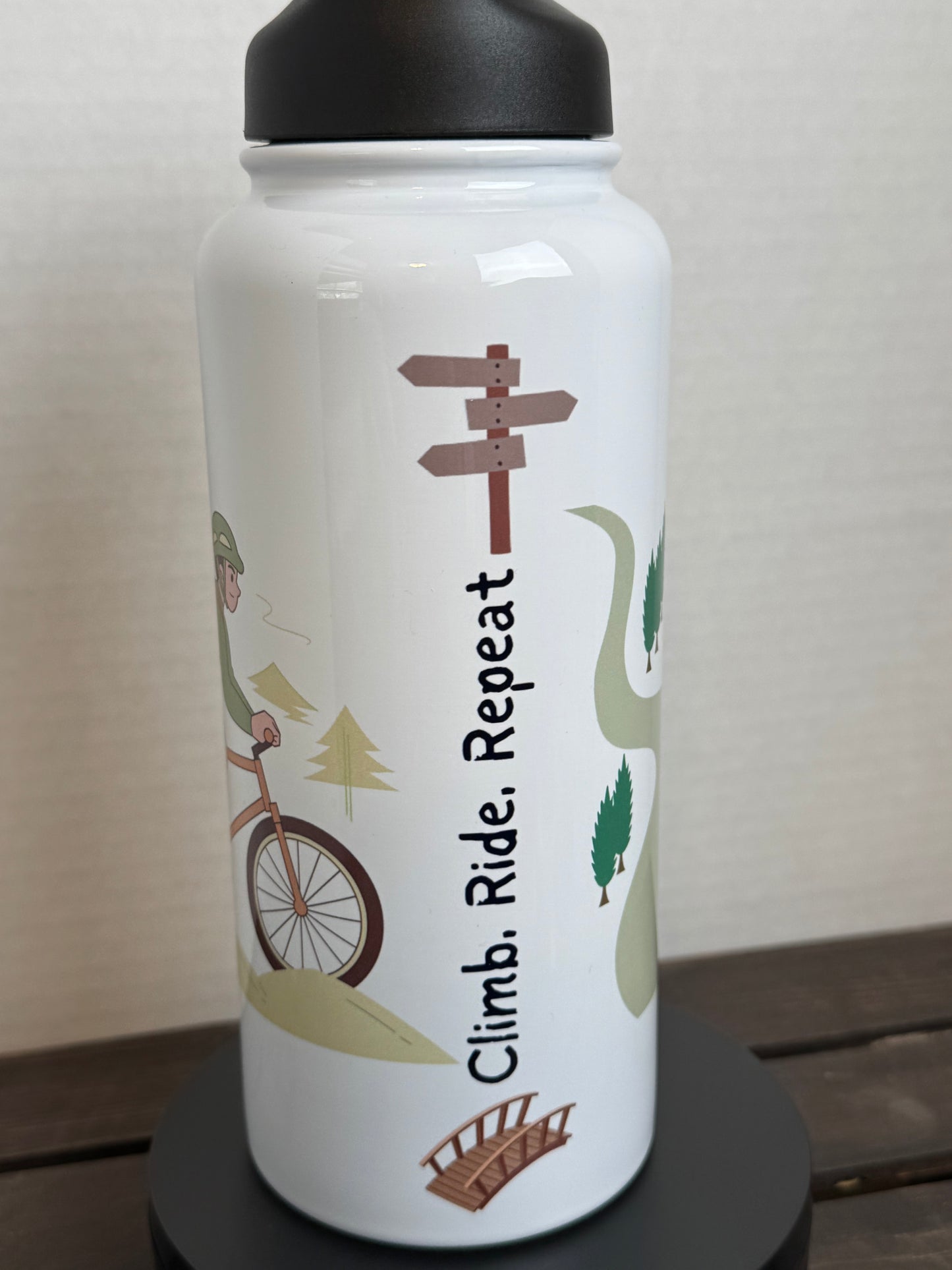 climb ride repeat water bottle
