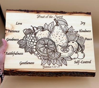 Fruit of the Spirit Live Edge Wood Plaque - Galatians 5:22-23 - Fruit of the Spirit wooden plaque featuring an engraved fruit illustration with words such as Love, Patience, Goodness, Faithfulness, Gentleness, Self-Control, Joy, Kindness, Peace.