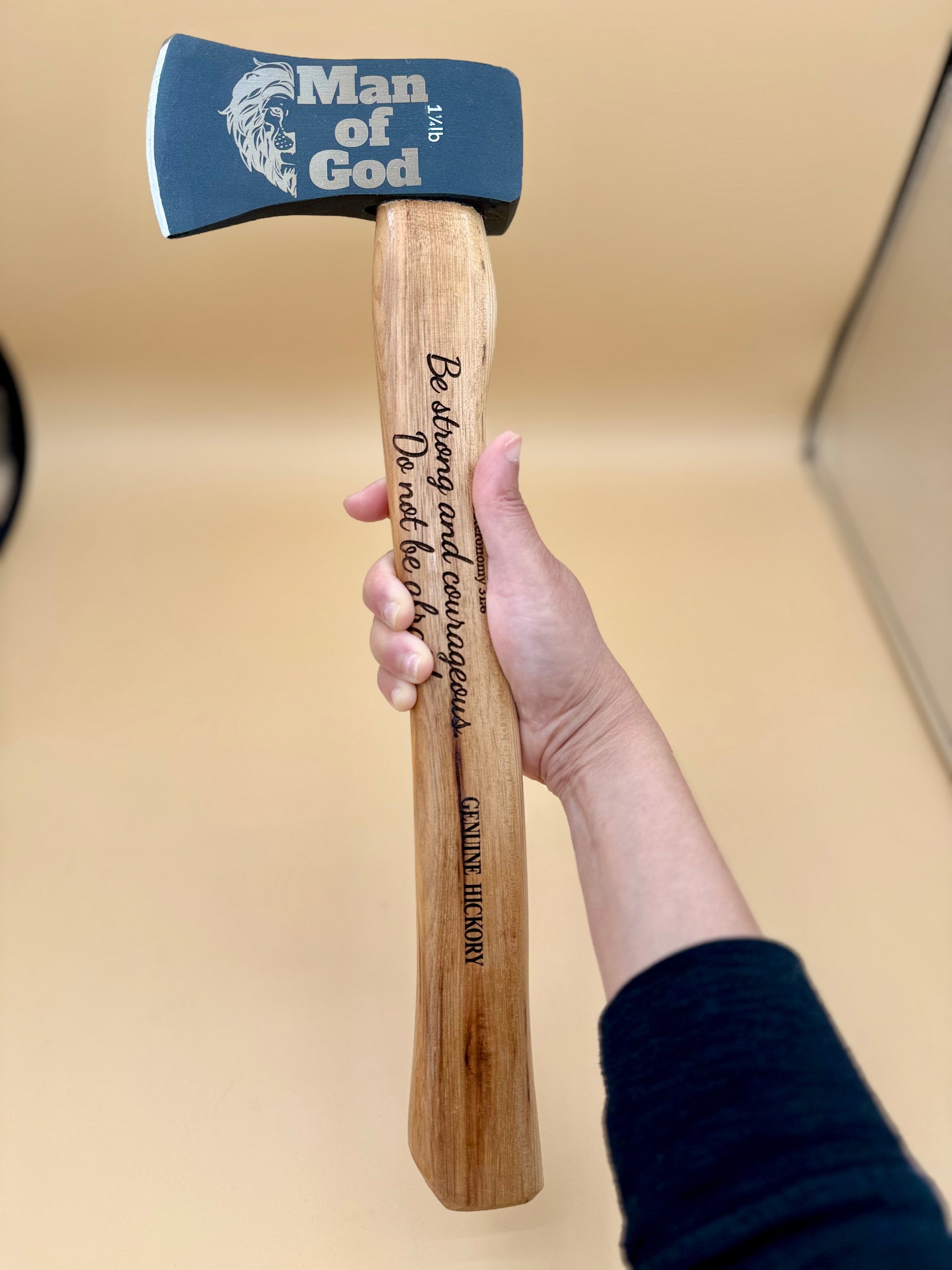 Man of God Laser Engraved Hickory Camp Hatchet (Deuteronomy 31:6) - Man of God hickory camp hatchet with Deuteronomy 31:6 engraving, held vertically — His Word Designs