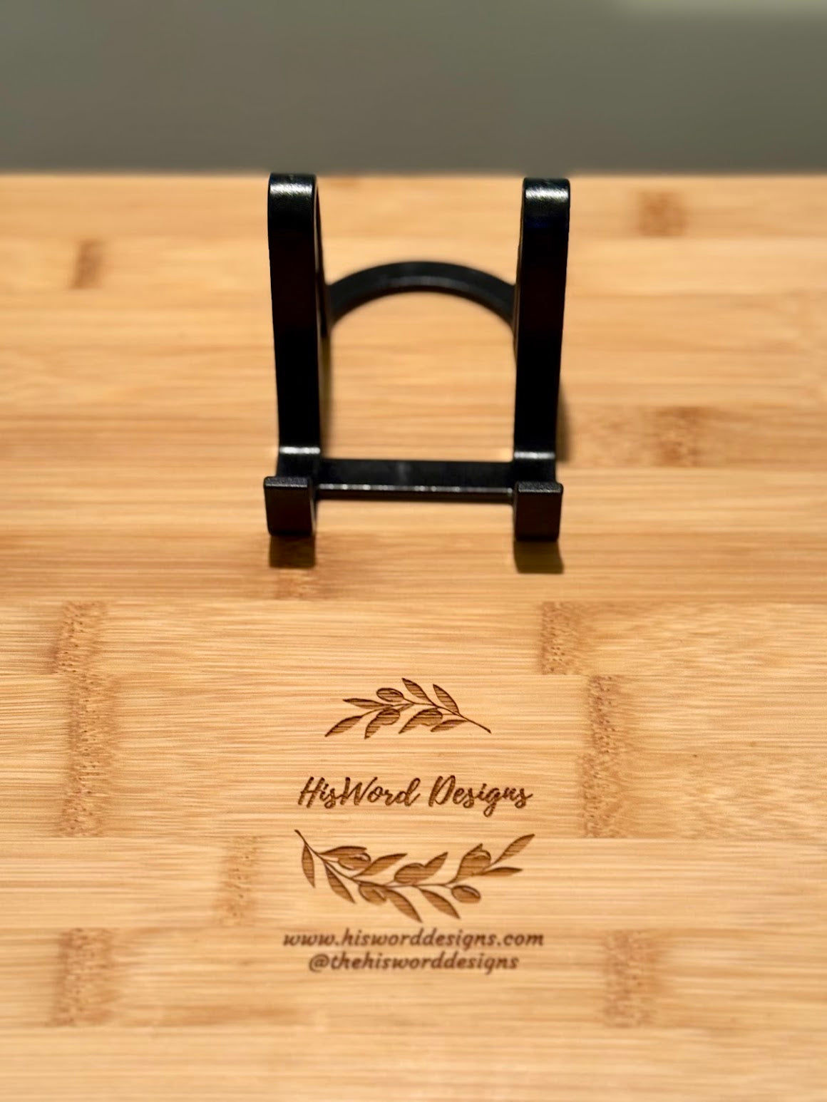 Tabletop & Shelf Display Stands for Boards, Slate & Keepsakes - Black tabletop display stand for boards, slate, and keepsakes on branded wood surface — His Word Designs